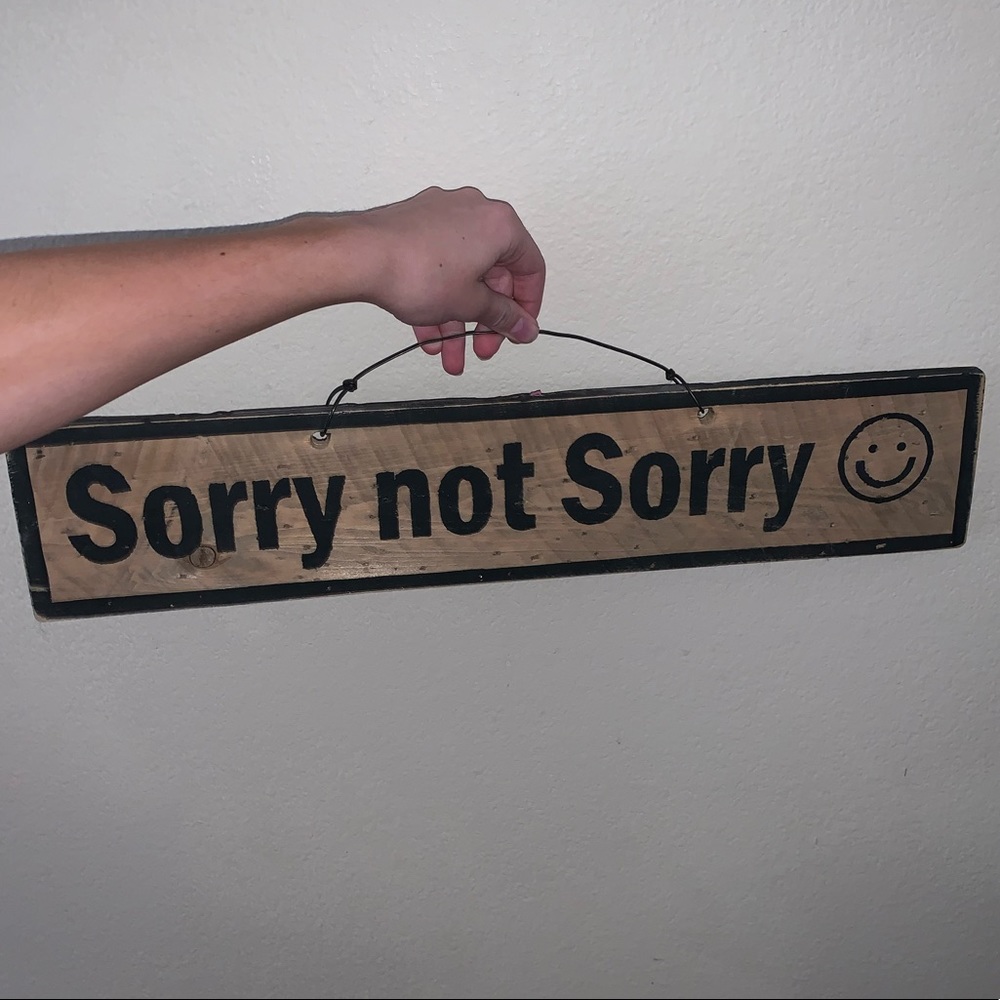 “sorry not sorry” wooden sign